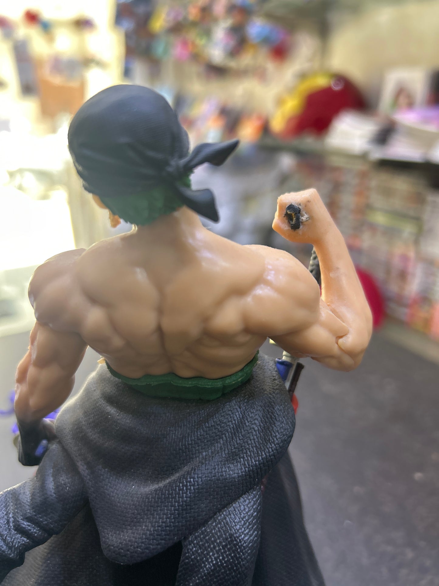 (Defective Piece)Killer Zoro Action Figure (the sword in hand is broken the images are given)will come with an extra spare sword which can be fixed with glue!