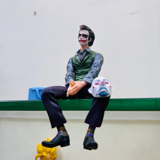 Joker with mask and bag figure